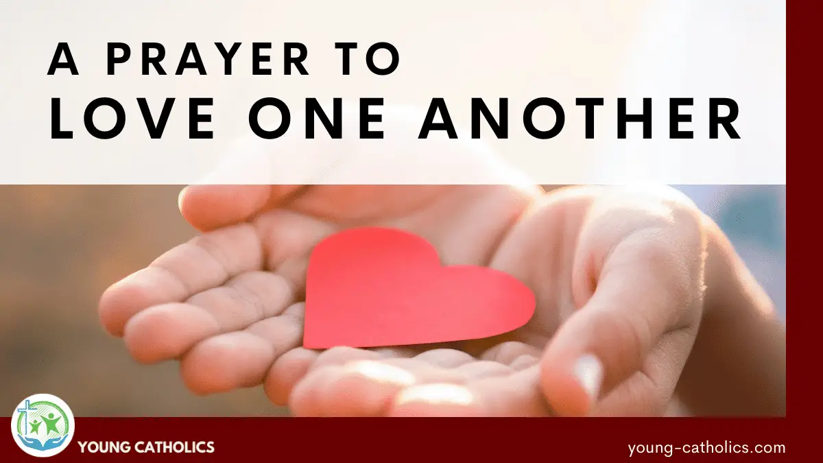 Open hands with a red paper heart resting in them, showing an attitude of love for this Prayer to Love One Another.